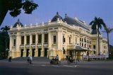 The Hanoi Opera House is modelled on the Paris Opera designed by Charles Garnier and completed in 1875. It is known in Vietnamese as Nha Hat Lon or ‘Big Song House’ and opened in 1911 incorporating the same grand elements of Garnier’s Napoleonic design. It remains the centrepiece of French architecture not just in Hanoi, but in all of former French Indochina and its presence would grace any city in the world.<br/><br/> 

Before the Second World War, the Opera was at the centre of French cultural life in Hanoi. After independence, however, it gradually fell into disrepair. Occasionally Chinese or Russian artistes would appear – perhaps a performance of the militant ballet beloved of Madame Mao, 'The Red Detachment of Women', or a musical recital by a visiting fraternal ensemble from Moscow or Minsk – but by the mid-1980s even these limited cultural exchanges had ceased, and the once grand Hanoi Opera was all but abandoned.<br/><br/>  

In 1994, the authorities decided to restore and reopen the Opera in a three-year project costing US$14 million. Today the grandly colonnaded colonial edifice, repainted in mustard yellow and white, and filled with refurbished gilt mirrors and ornate grand stairways, must be every bit as magnificent as on the day it opened in 1911.<br/><br/>

As the Hanoi Opera has grown in confidence and popularity, so it has staged some quite unusual and innovative programmes – for example a version of Christoph Gluck’s two-century old opera Orfeo et Euridice in Vietnamese.